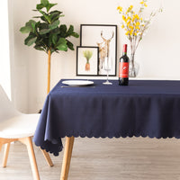 Navy blue shiny stain resistant table cloth complementing a dining table