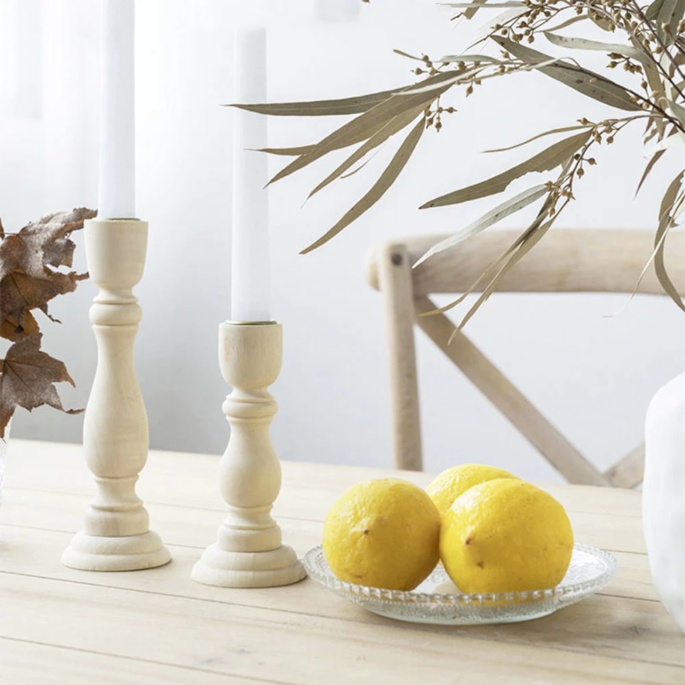 Wooden candlesticks on a table, finishing the table decoration