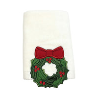 Embroidered cotton towel featuring a three-dimensional wreath design, adding festive texture to your decor