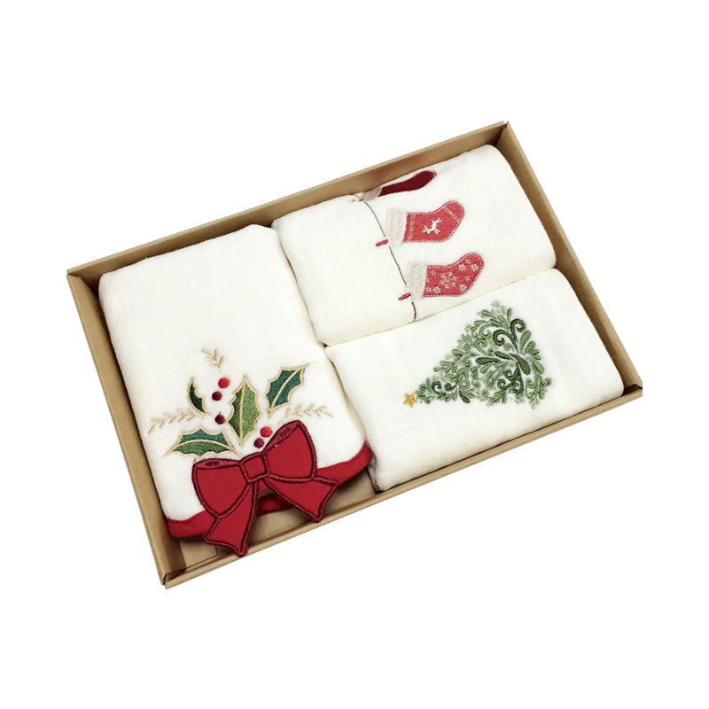 Set of three embroidered cotton towels in a gift box, perfect for Christmas gifting.