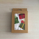 Cotton towel with an embroidered design of wrapped holiday gifts, perfect for spreading Christmas cheer.