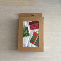 Cotton towel with an embroidered design of wrapped holiday gifts, perfect for spreading Christmas cheer.