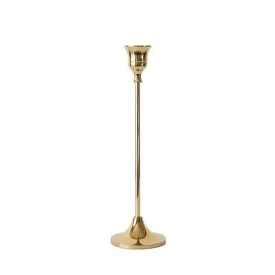 A tall gold color candle stick