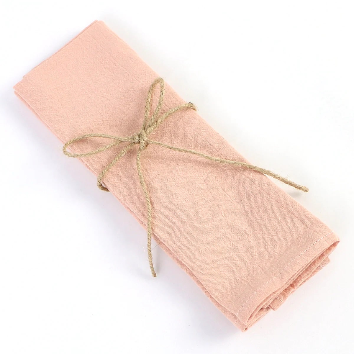 Peach-colored cloth napkins, for enhancing the elegance of delicate occasions and special moments.