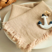 Khaki colored fringe napkin suitable for more casual eating