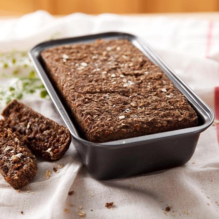 Bread baking pan with a fresh baked bread in it