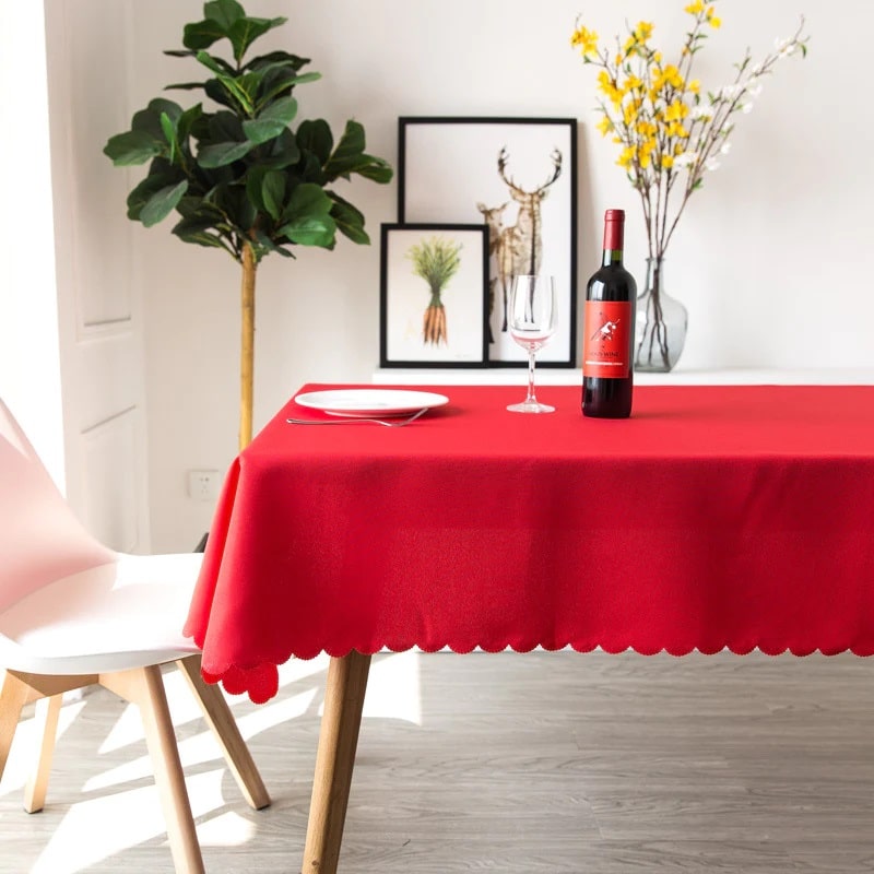 A red fabric stain resistant tablecloth