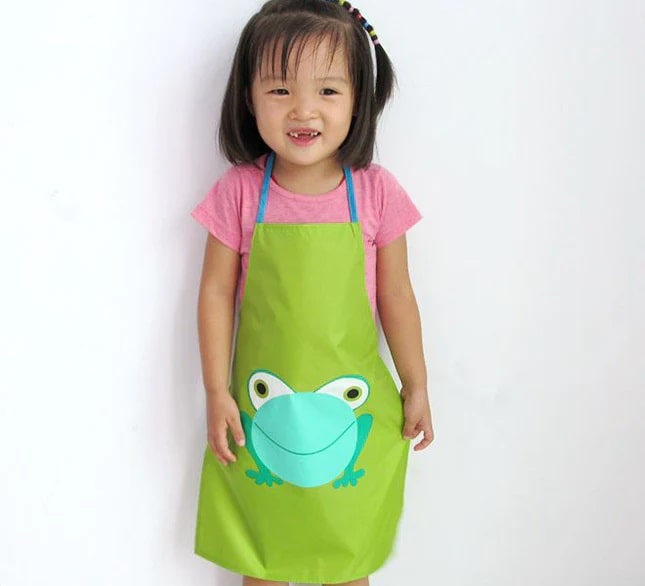 Green children's smock with a funny frog print