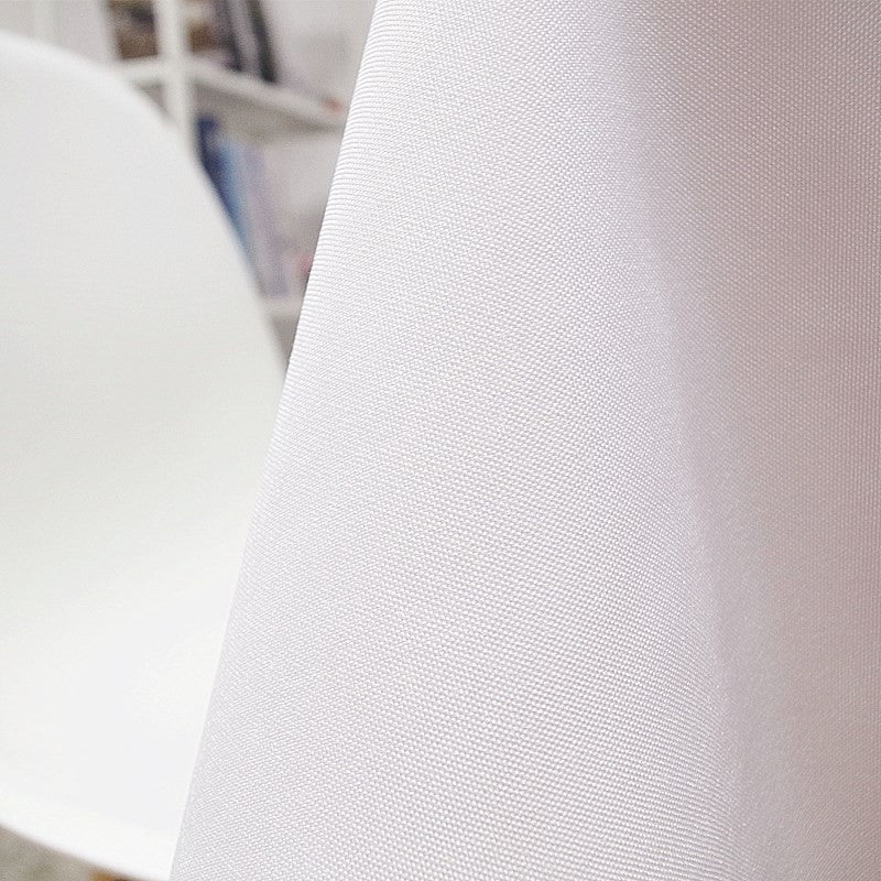 A close-up of a waterproof stain-resistant white tablecloth