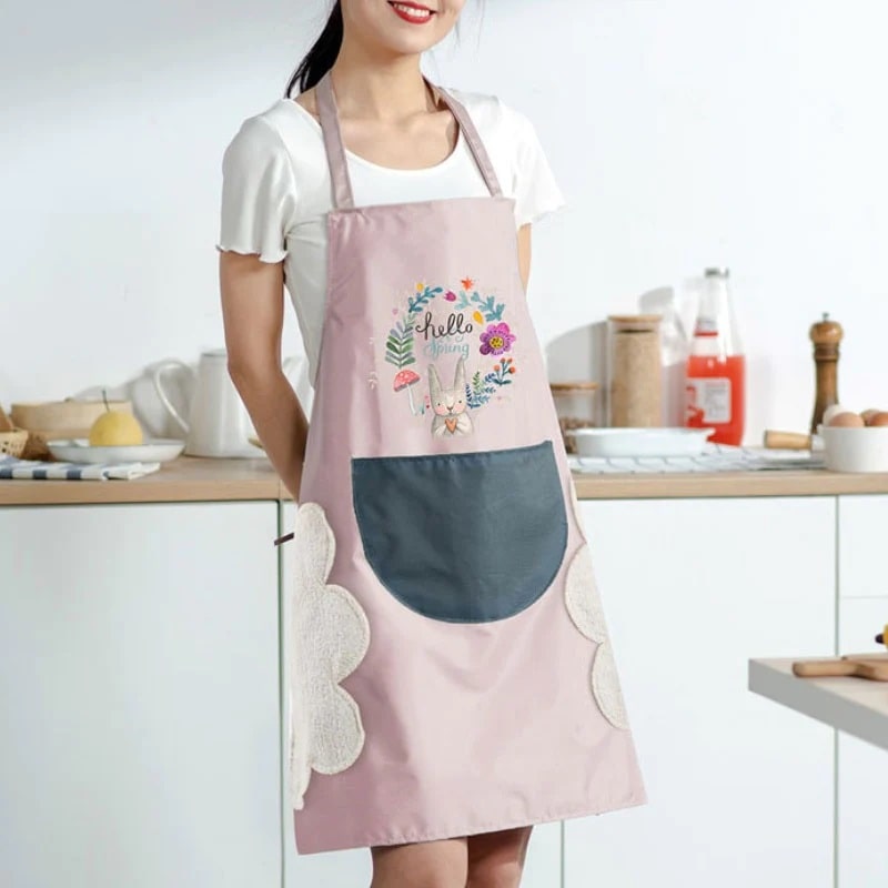 A woman wearing a pink kitchen smock