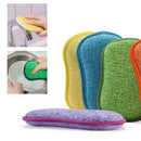 Cheery colored double-sided sponges performing it's tasks in the kitchen