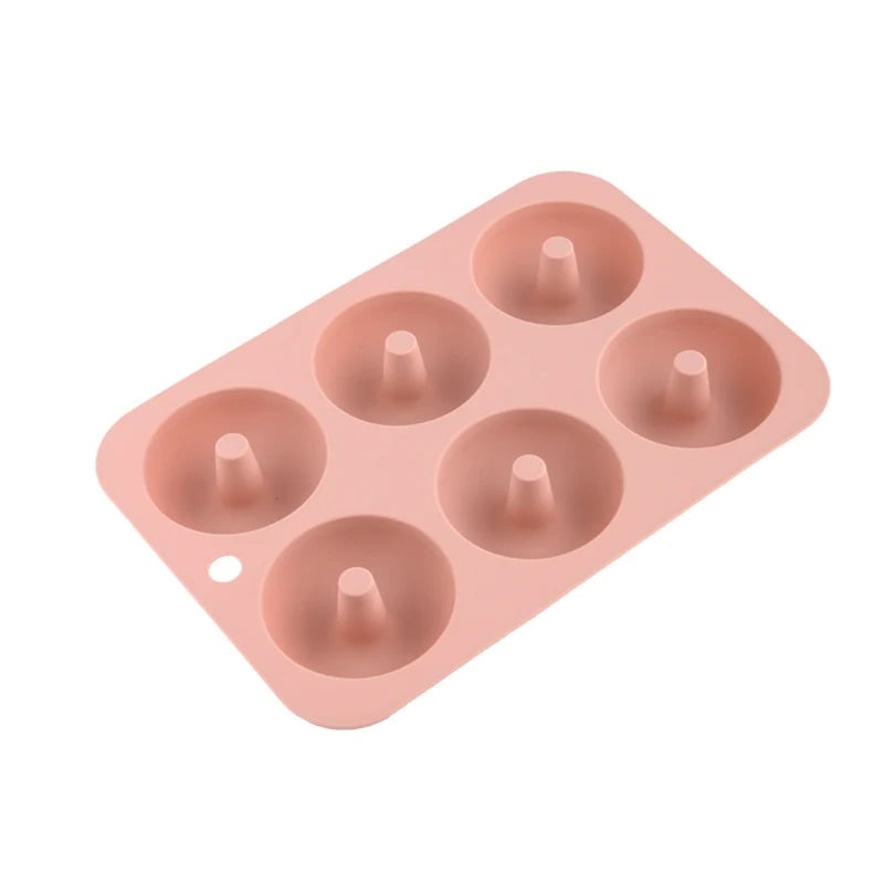 A convenient pink silicone mold for more enjoyable doughnut baking