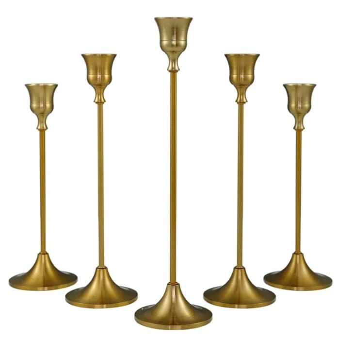 A set of five metal candle sticks