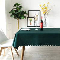 Let this dark green tablecloth add a touch of shine to your dining table