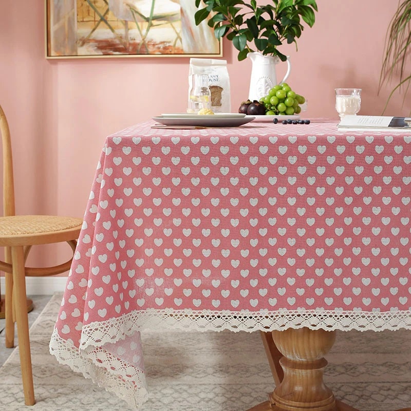 A cute heart-printed table linen, adding a charming touch to the dining setting and bringing joy to the diners.