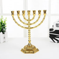 A metallic golden color candle stick