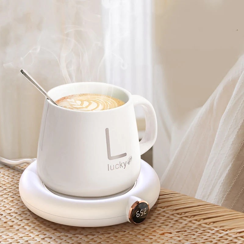 A hot cup of coffee on a heating plate