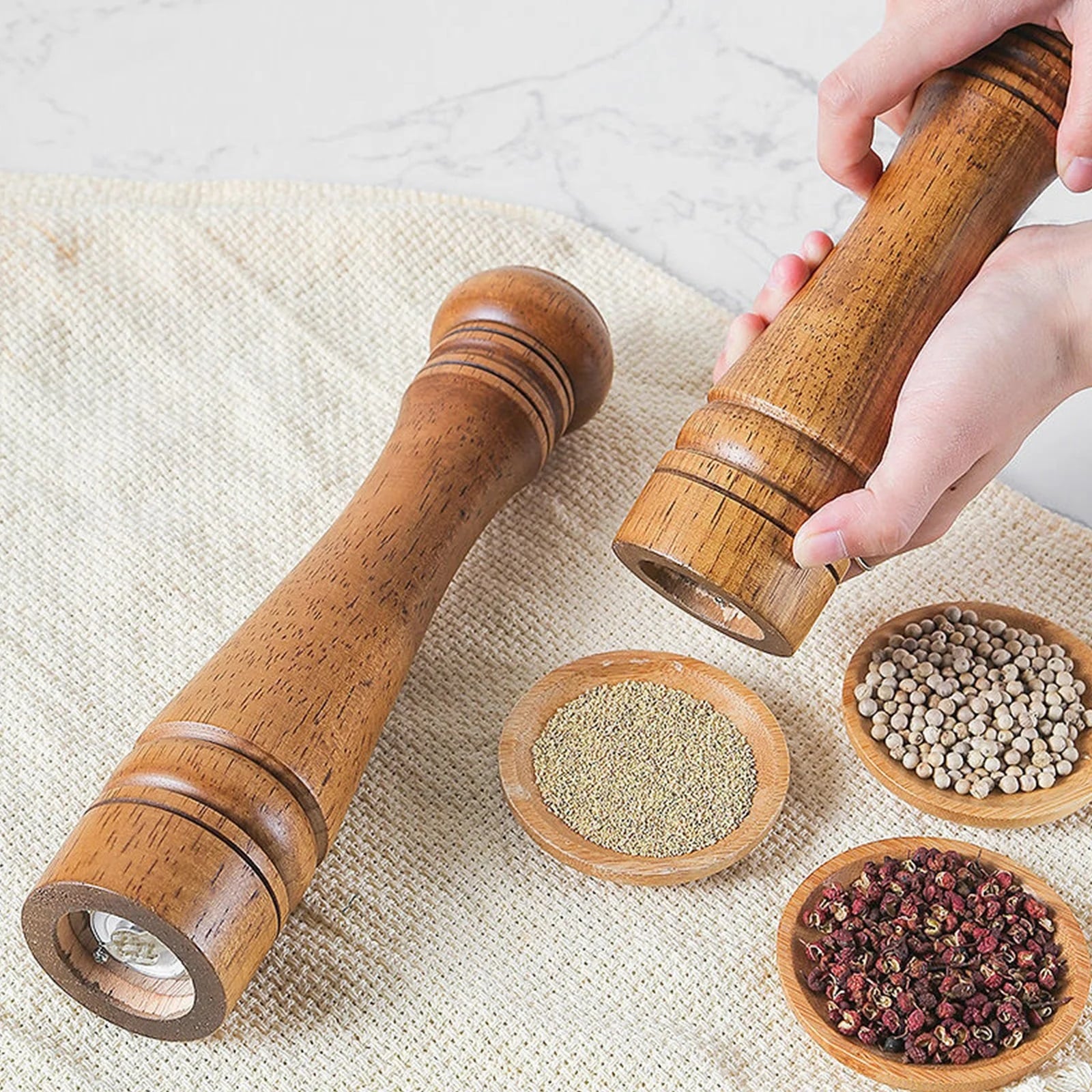 Grind dried spices with this stylish and long-lasting oak wooden spice grinder.