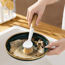 Pot brush removing dirt from a plate