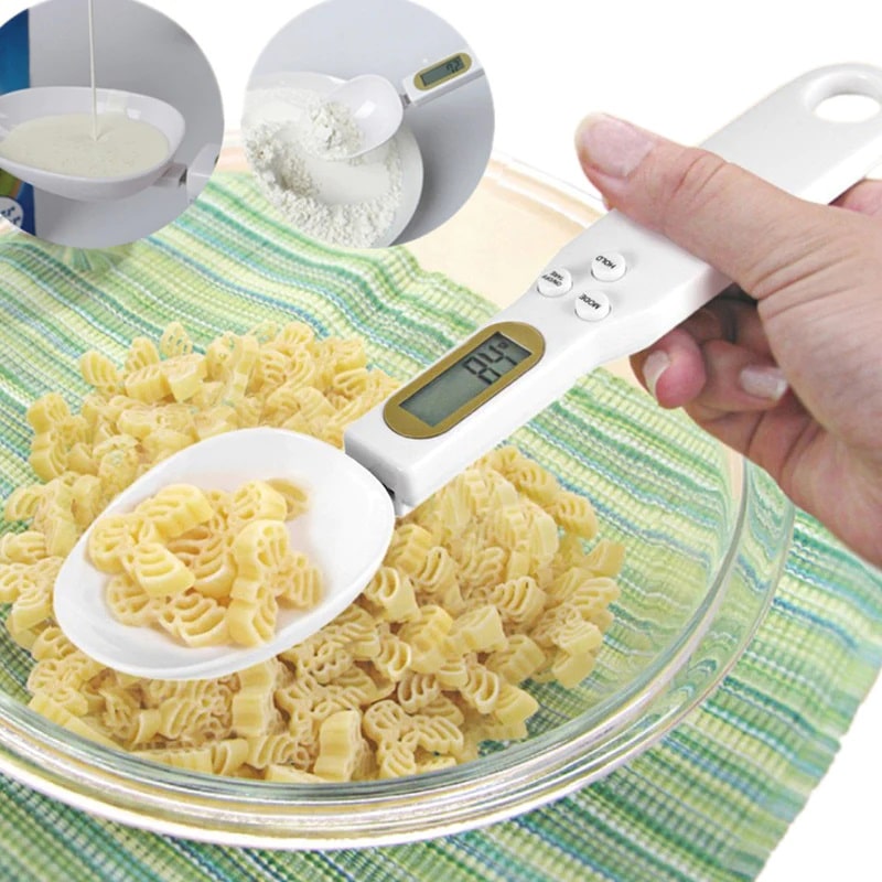 White measuring scale spoon weighing pasta