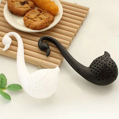 Bird tea strainers with a plate of cookies