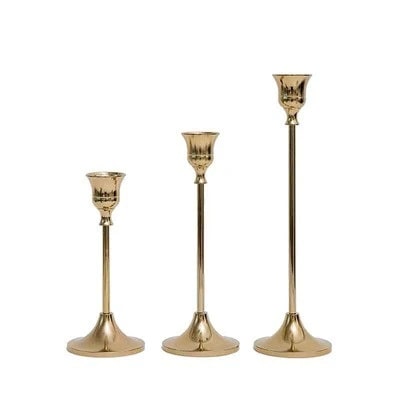 Three metal candle holders in different sizes